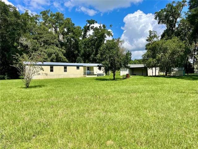 a view of a swimming pool with a bench