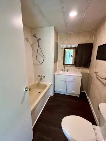 a bathroom with a sink a toilet and a bathtub
