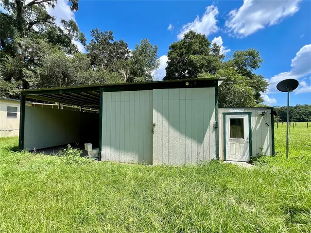 a backyard of a house with lots of green space