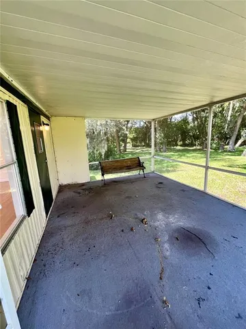 a view of room with window and furniture