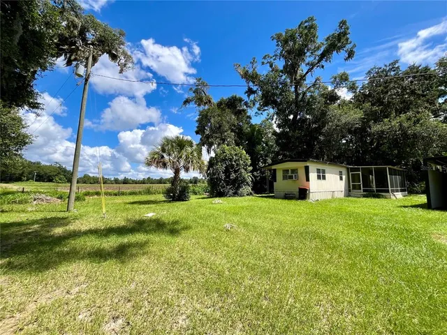 a view of a house with a big yard
