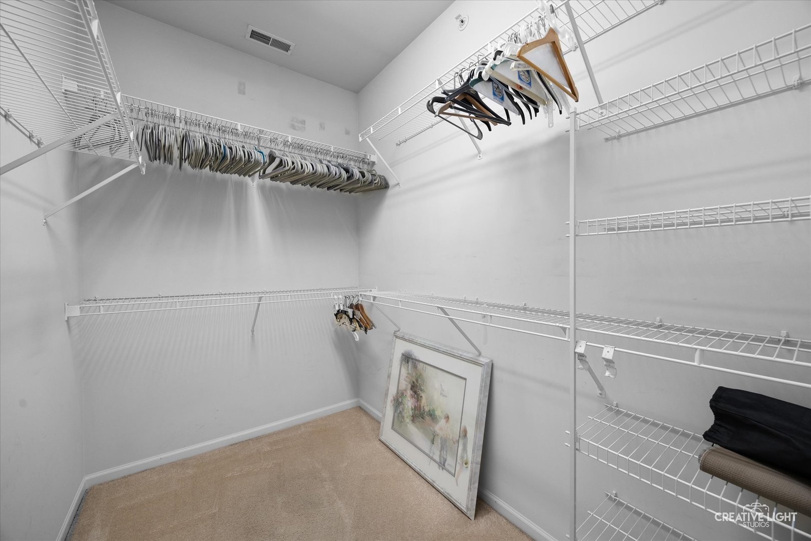 13611 Hemlock Road Huntley, IL 60142 - Photo 13 of 16 a view of a room with racks on the wall