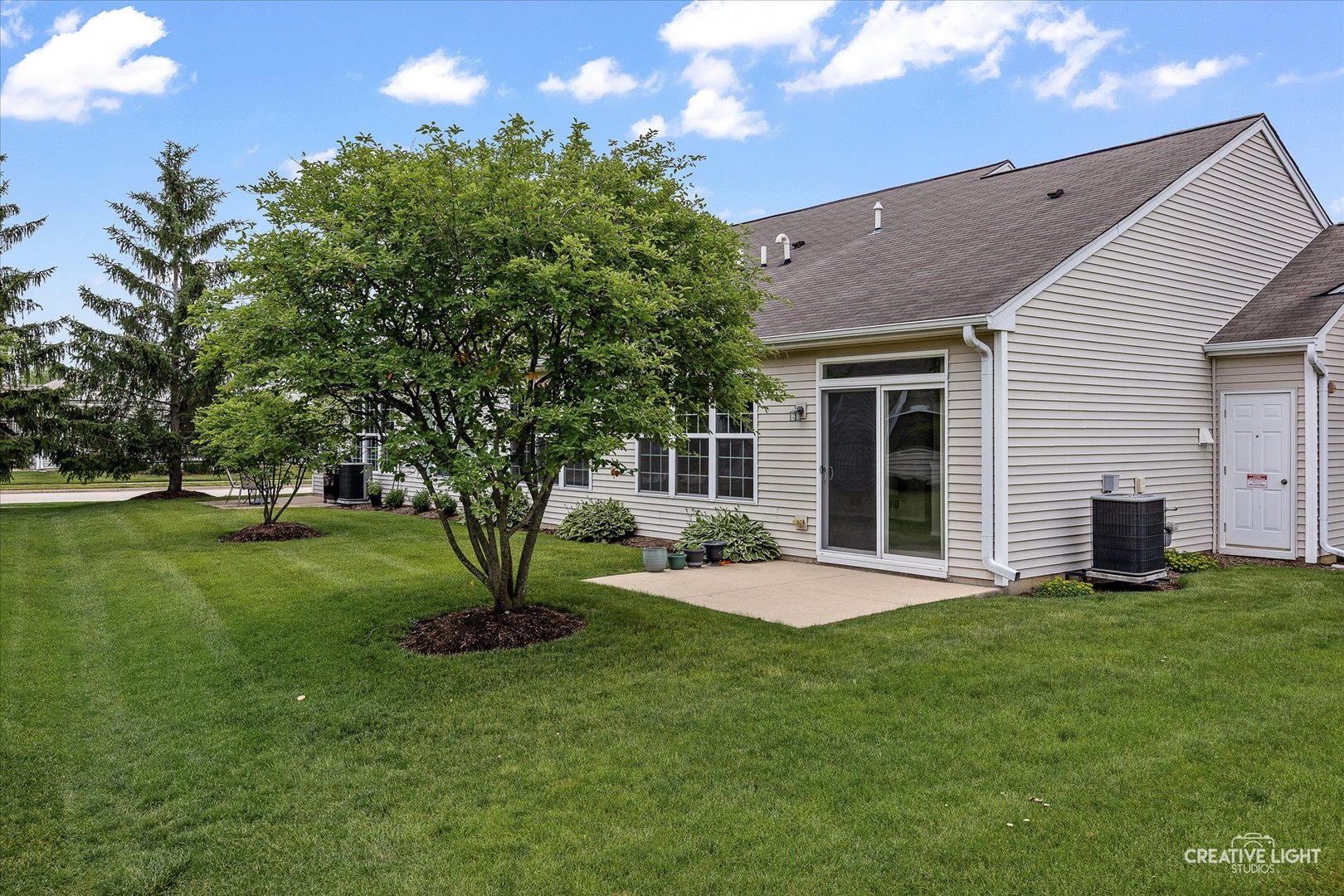 13611 Hemlock Road Huntley, IL 60142 - Photo 15 of 16 a view of a house with backyard and sitting area