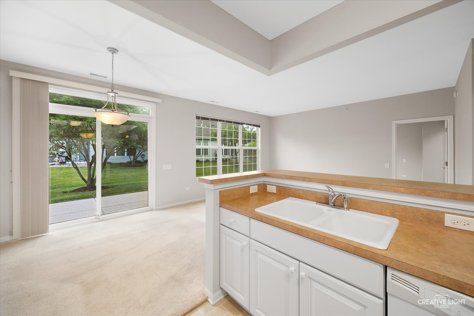 13611 Hemlock Road Huntley, IL 60142 - Photo 7 of 16 a bathroom with a tub sink and large window