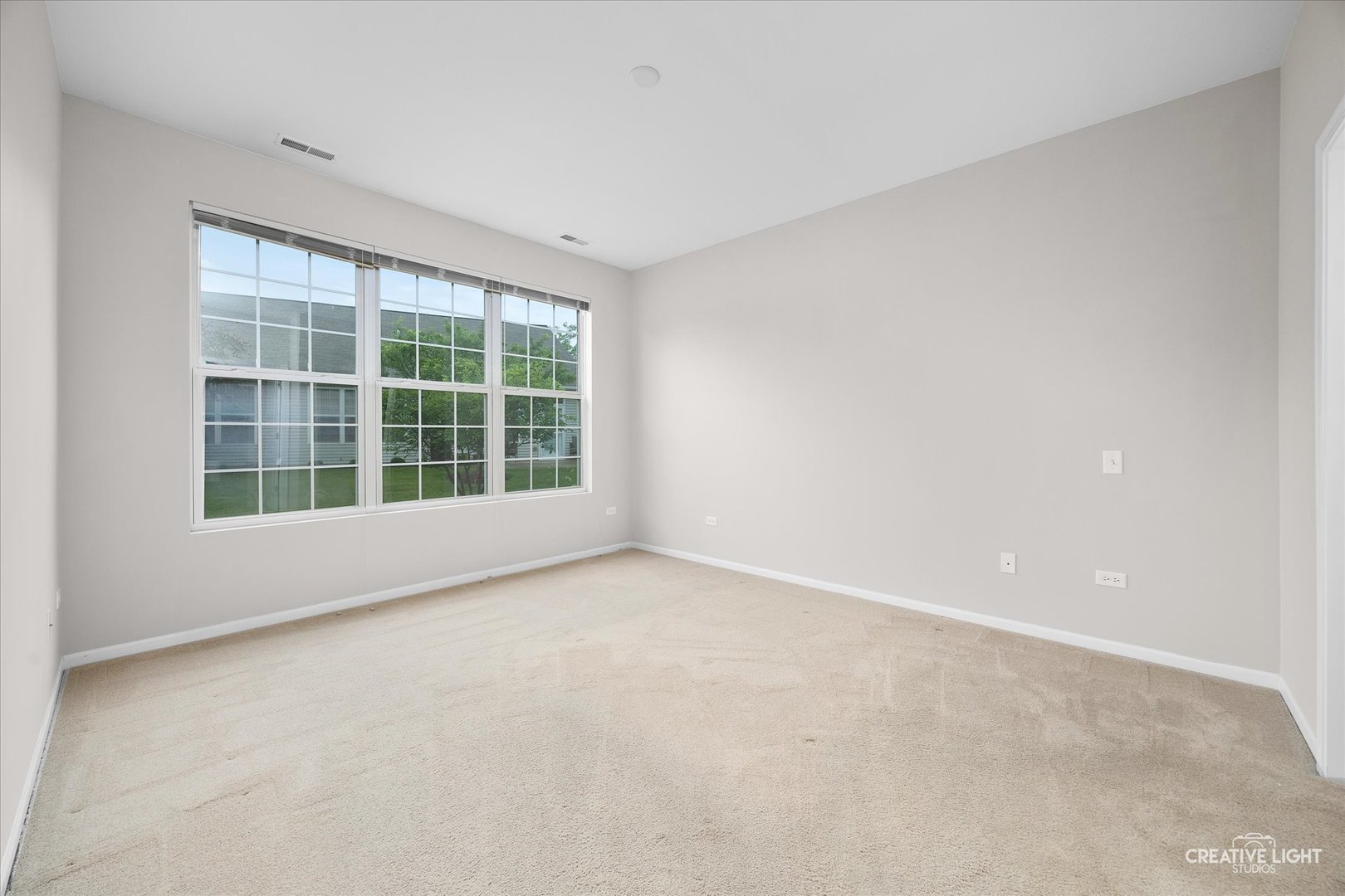 13611 Hemlock Road Huntley, IL 60142 - Photo 10 of 16 an empty room with a large window