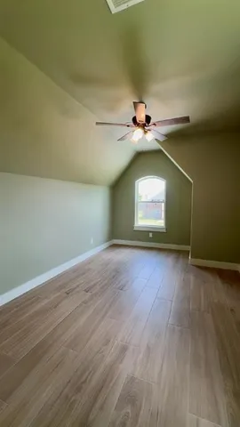 a view of an empty room and floor to ceiling window