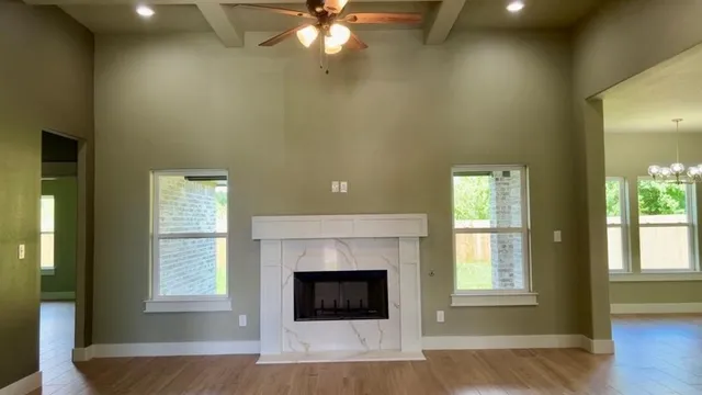 a living room with a fireplace and a window