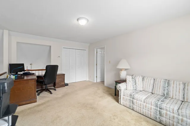 a workspace with furniture and a window