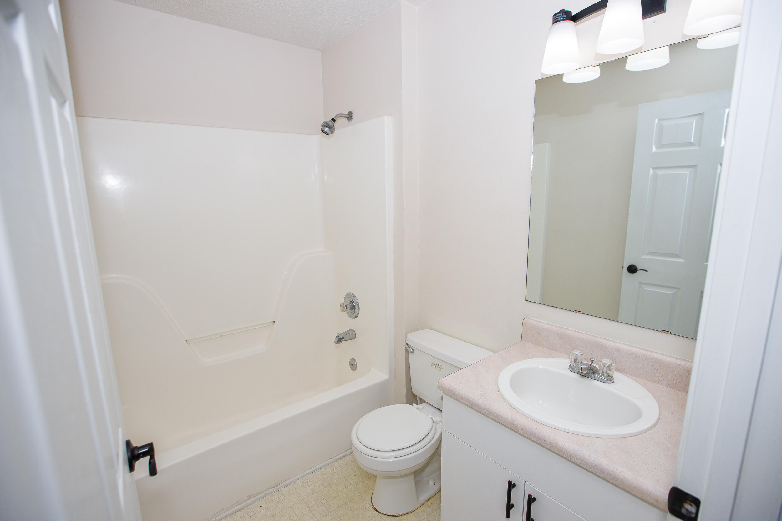 1305 Jefferyscot Court Crestview, FL 32536 - Photo 11 of 20 a bathroom with a sink a toilet a mirror and shower