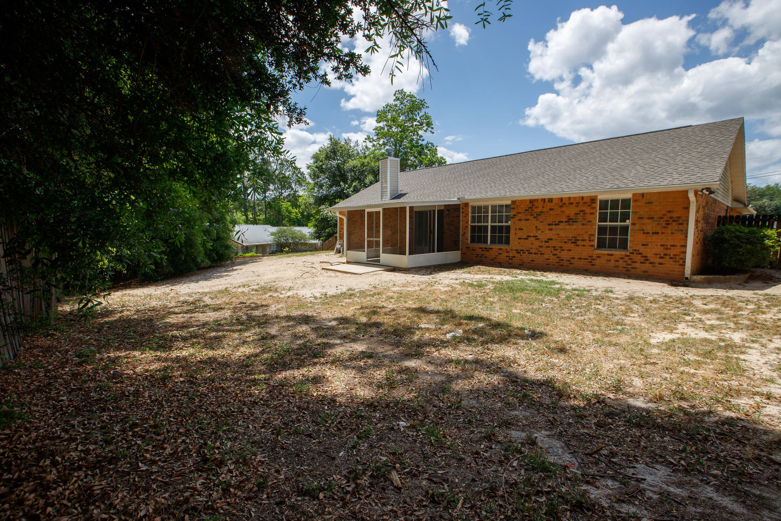 1305 Jefferyscot Court Crestview, FL 32536 - Photo 18 of 20 a view of a house with a yard