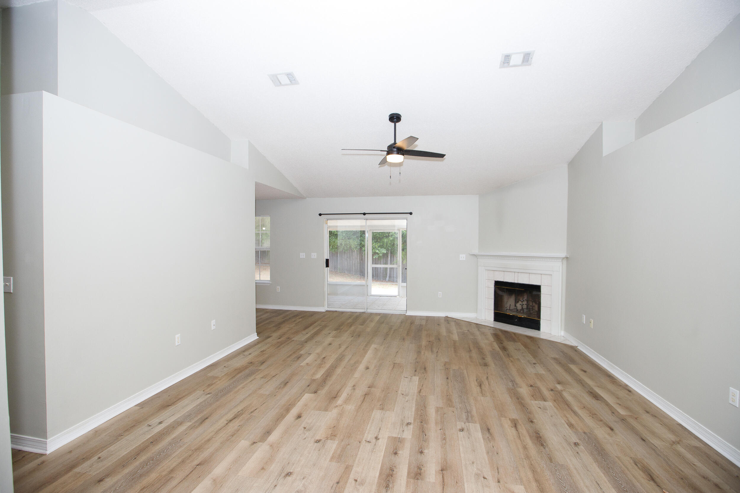 1305 Jefferyscot Court Crestview, FL 32536 - Photo 3 of 20 a view of empty room with wooden floor and fan