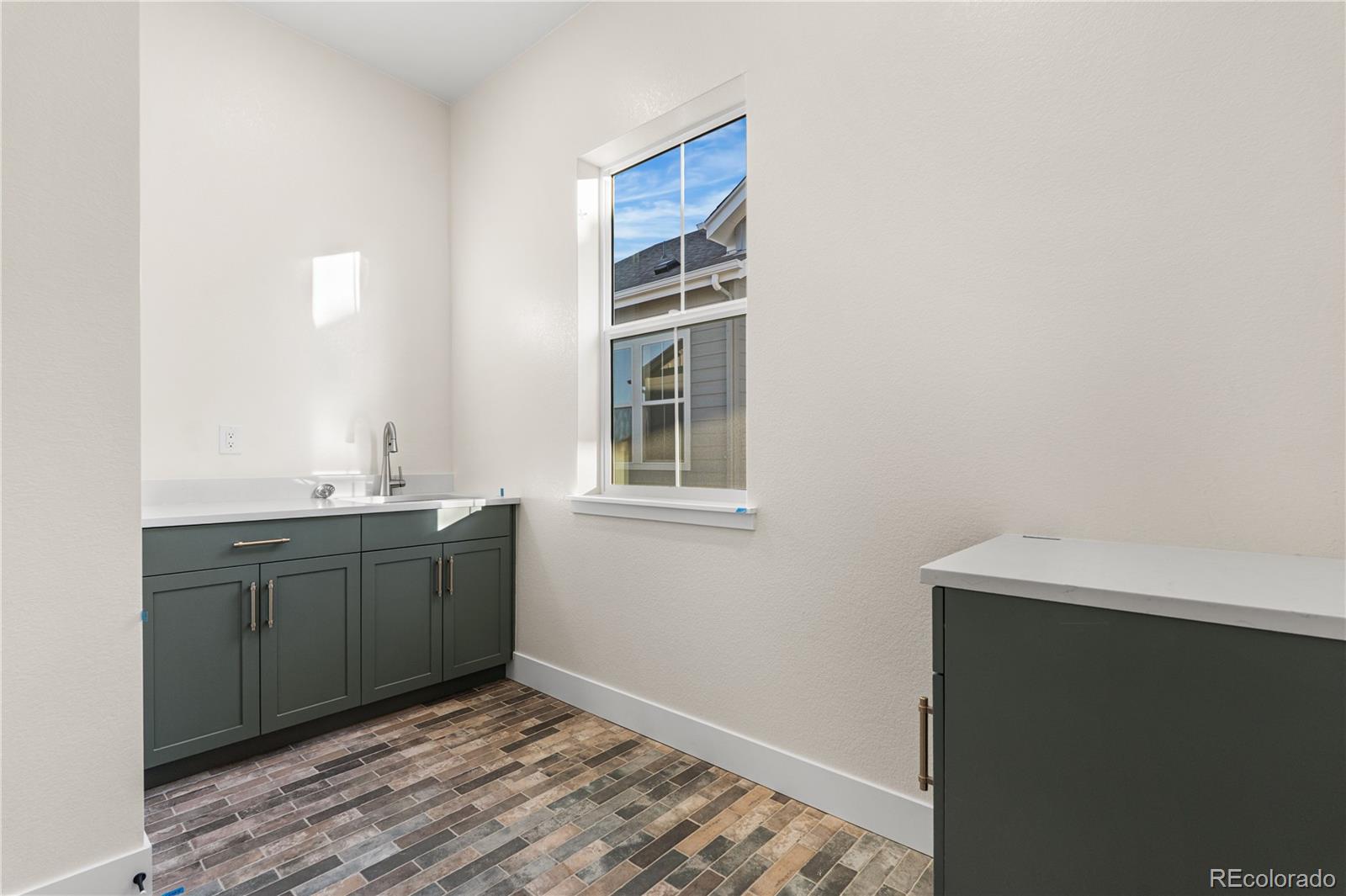 6749 Fawn Path Lane Castle Pines, CO 80108 - Photo 18 of 33 a room with a sink and a mirror