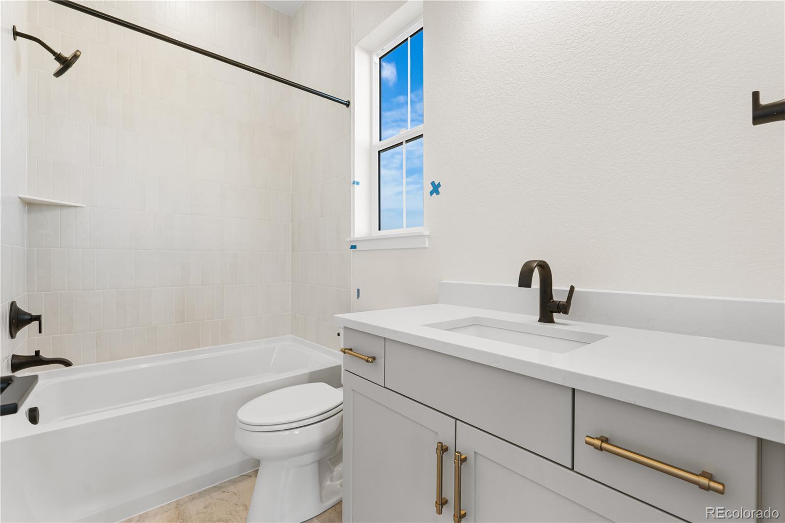6749 Fawn Path Lane Castle Pines, CO 80108 - Photo 20 of 33 a bathroom with a granite countertop sink toilet and shower