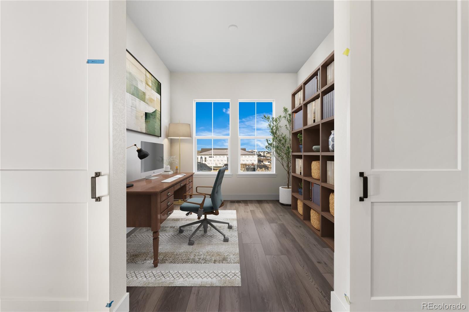 6749 Fawn Path Lane Castle Pines, CO 80108 - Photo 27 of 33 a workspace with furniture and a book shelf