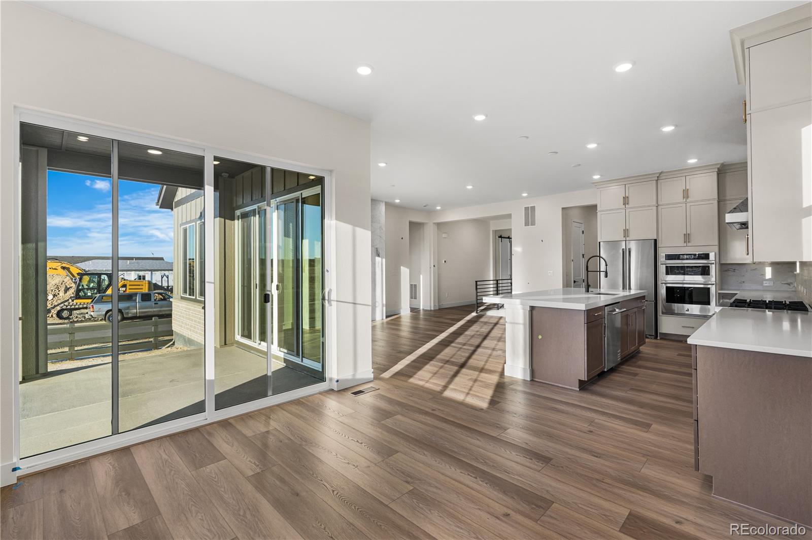 6749 Fawn Path Lane Castle Pines, CO 80108 - Photo 3 of 33 a view of kitchen with cabinets and wooden floor