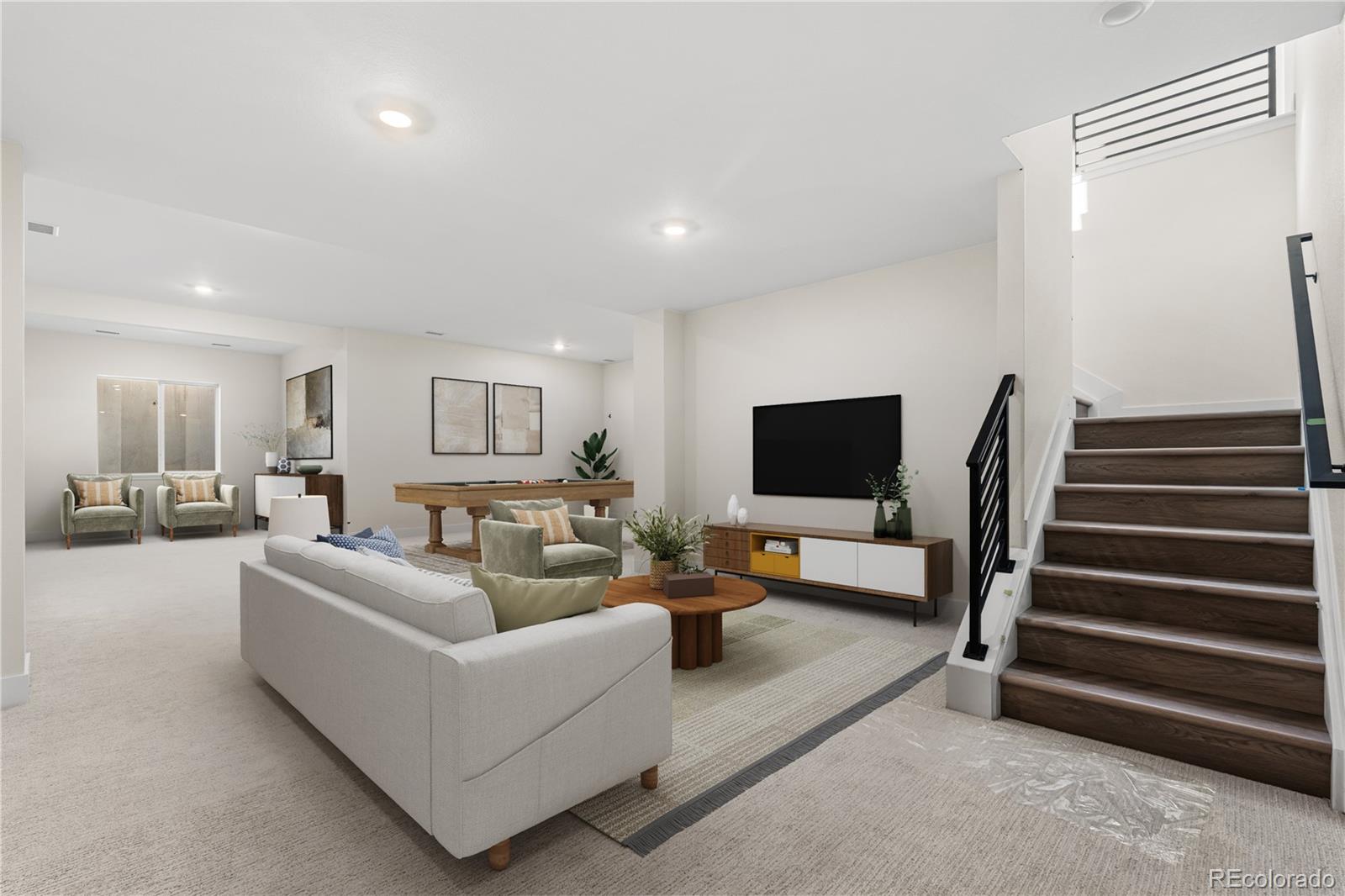 6749 Fawn Path Lane Castle Pines, CO 80108 - Photo 4 of 33 a living room with furniture and a flat screen tv