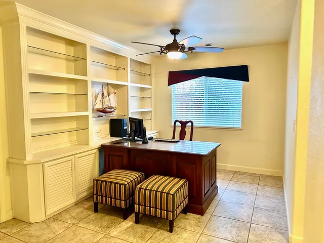 a kitchen with a sink and a refrigerator
