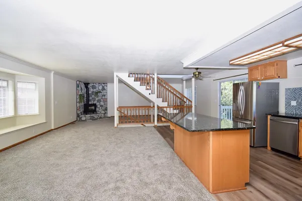 an entryway and stairs with wooden floor