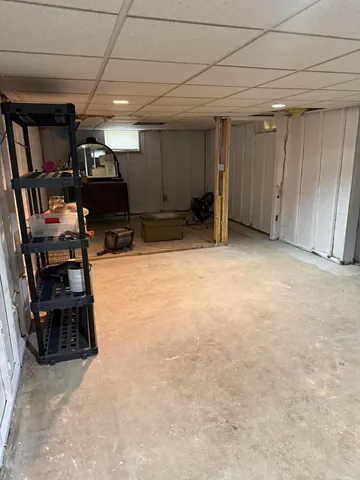 a storage room with sink washer and dryer