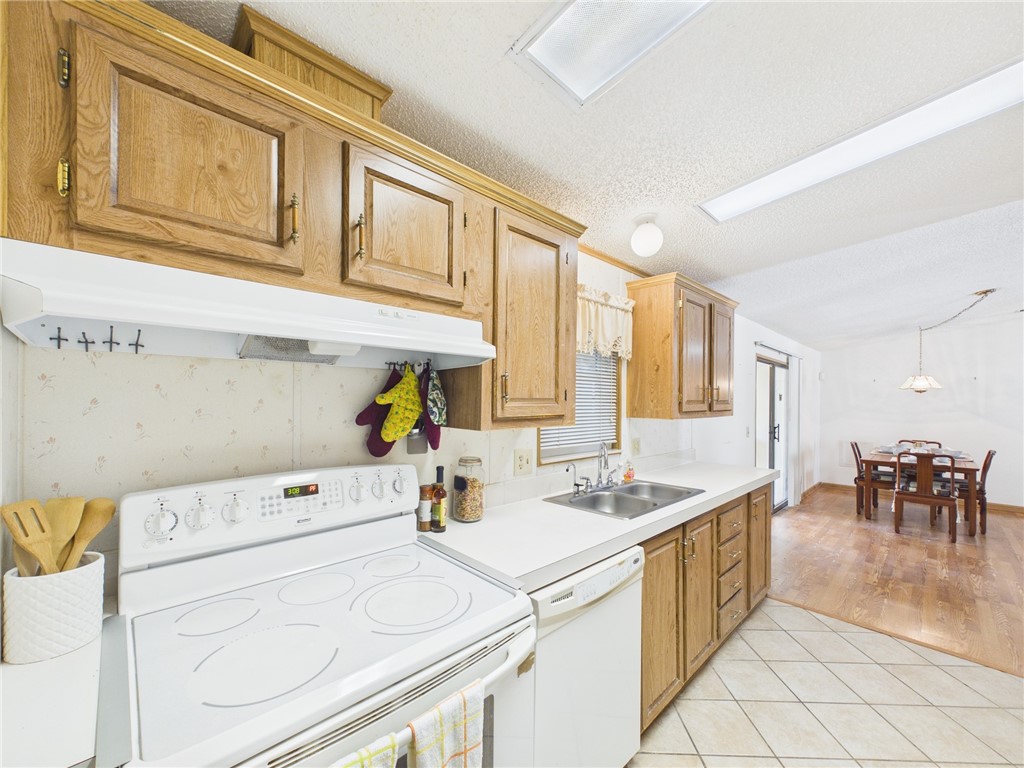 1203 Calusa Drive Sebastian, FL 32976 - Photo 11 of 27 a utility room with dryer and washer