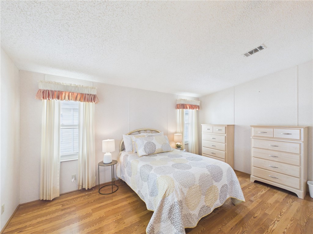 1203 Calusa Drive Sebastian, FL 32976 - Photo 23 of 27 a bedroom with a bed and a closet