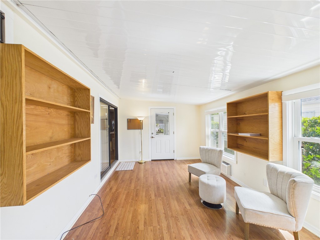 1203 Calusa Drive Sebastian, FL 32976 - Photo 25 of 27 a living room with furniture and a large window