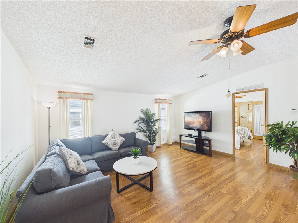 1203 Calusa Drive Sebastian, FL 32976 - Photo 5 of 27 a living room with furniture and a wooden floor