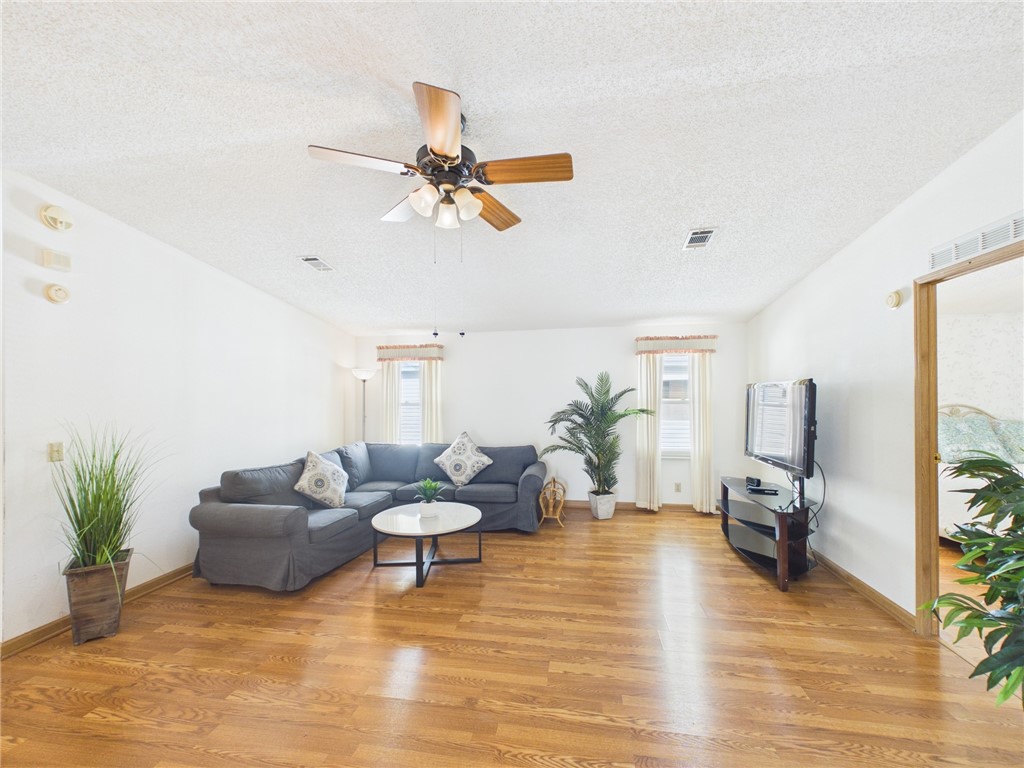 1203 Calusa Drive Sebastian, FL 32976 - Photo 6 of 27 a living room with furniture and a wooden floor