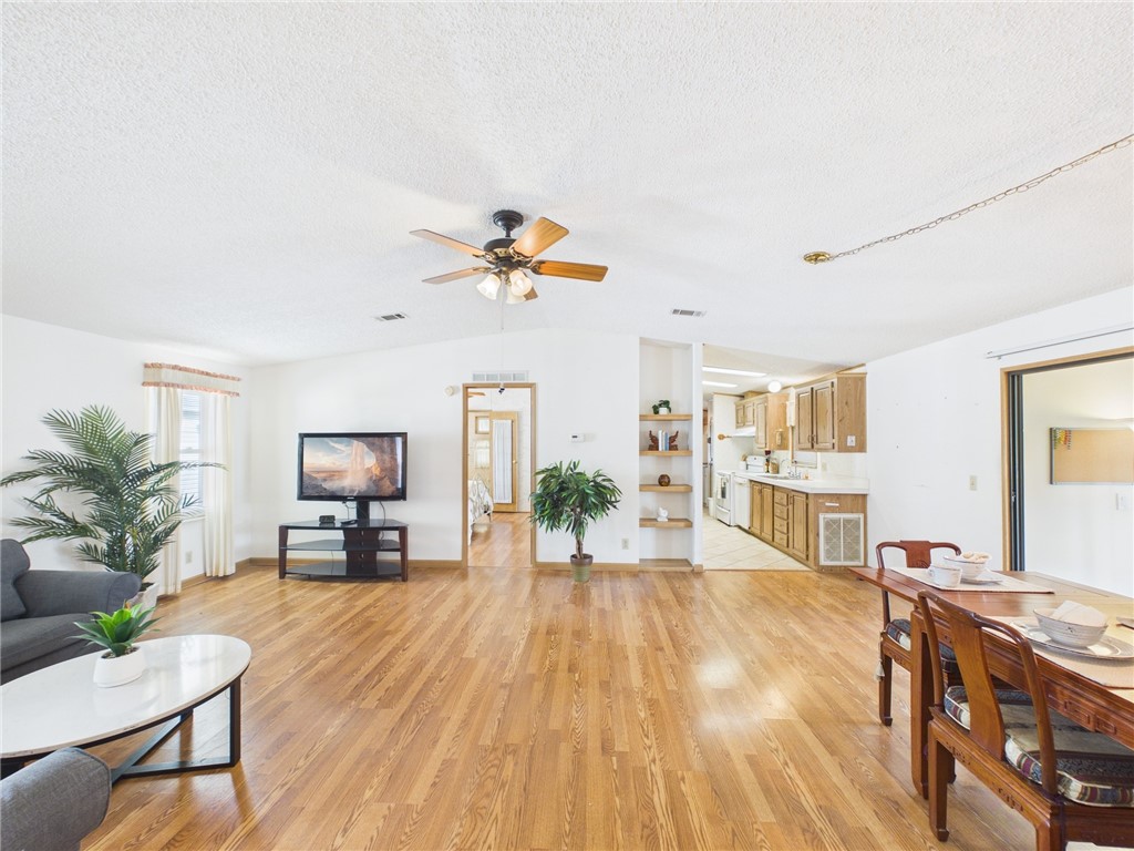 1203 Calusa Drive Sebastian, FL 32976 - Photo 7 of 27 a living room with furniture and a kitchen view