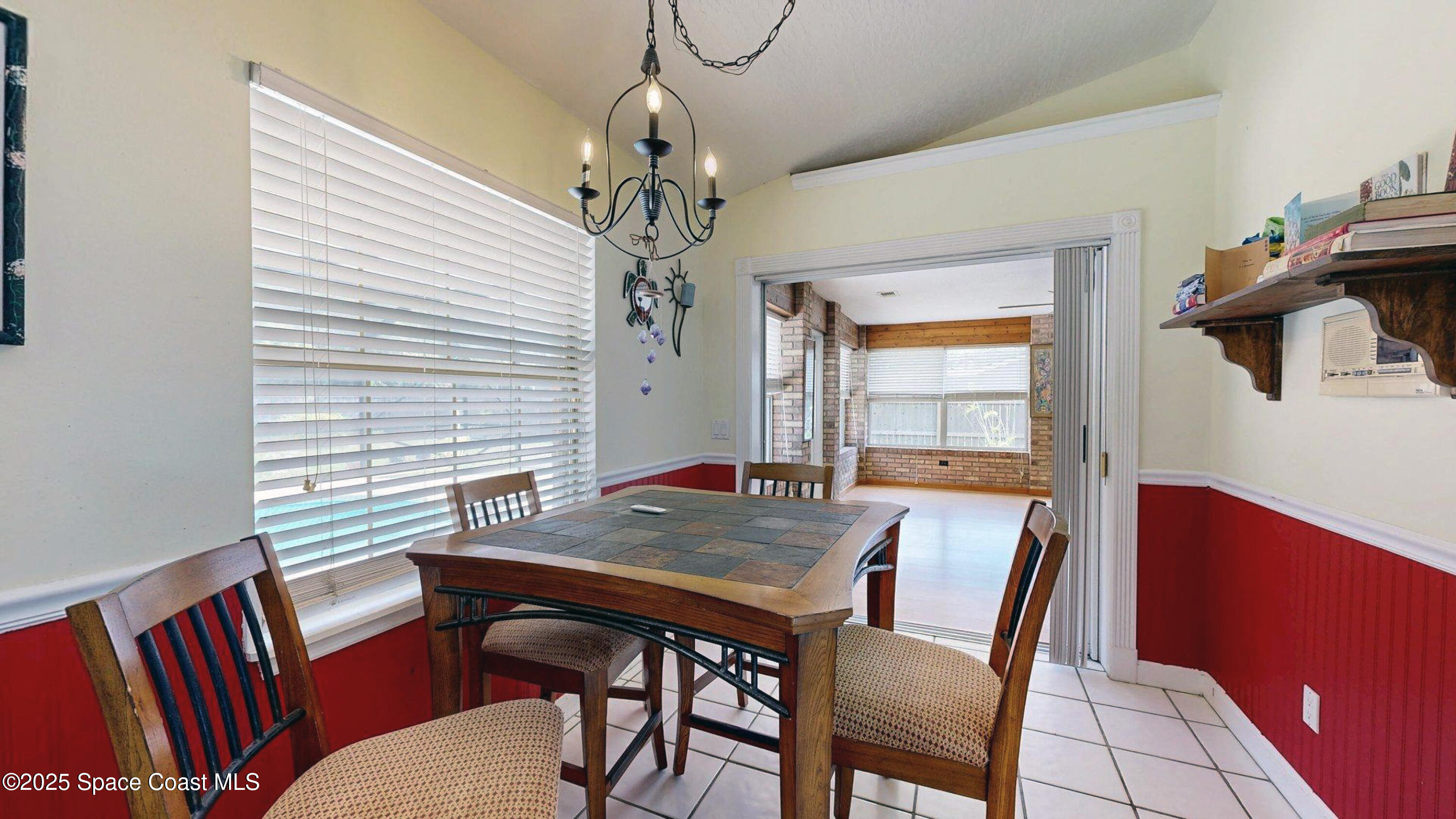 2832 School Drive Palm Bay, FL 32905 - Photo 11 of 55 a view of a dining room with furniture window and wooden floor