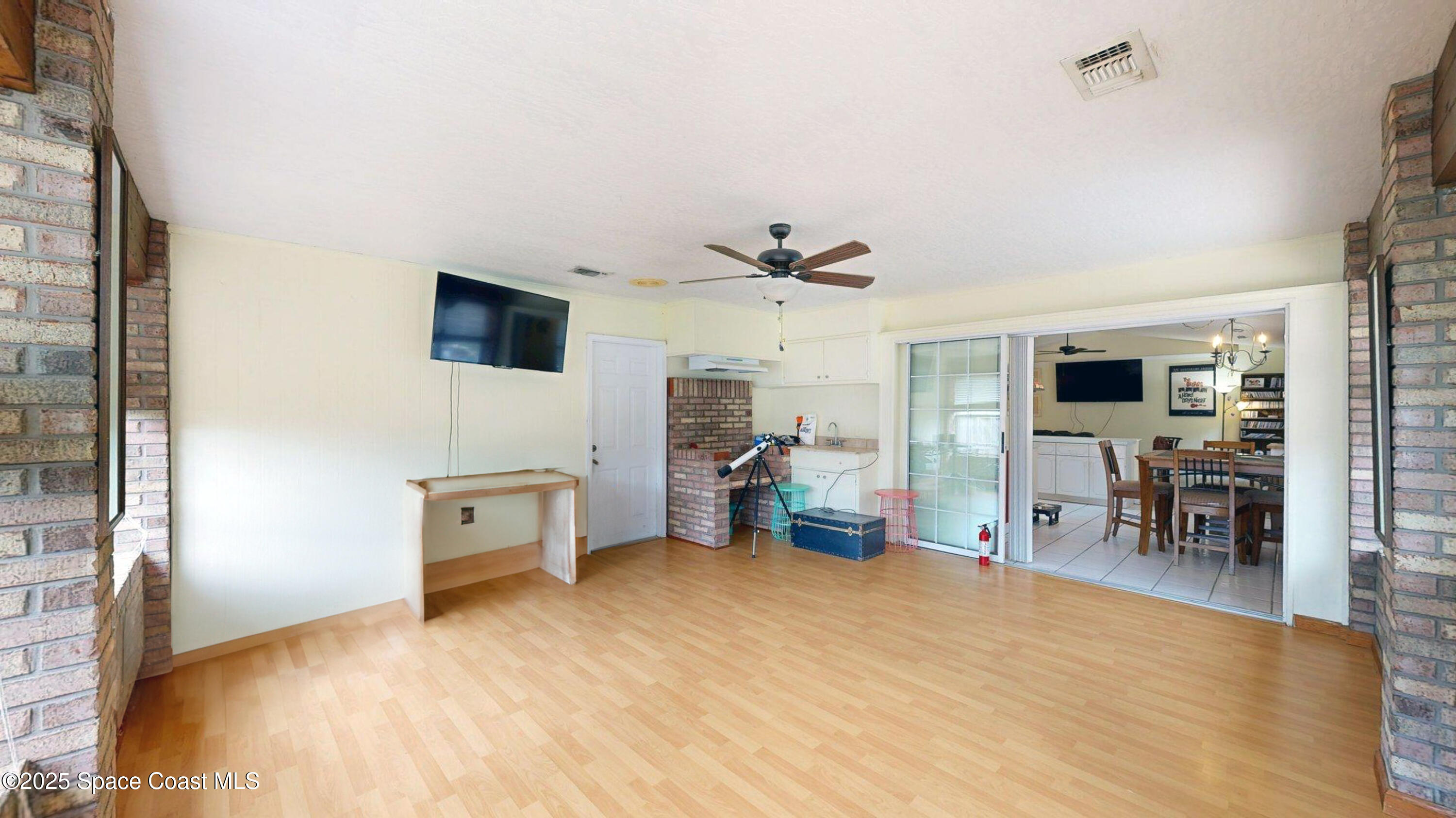 2832 School Drive Palm Bay, FL 32905 - Photo 14 of 55 a view of a livingroom with furniture and a flat screen tv