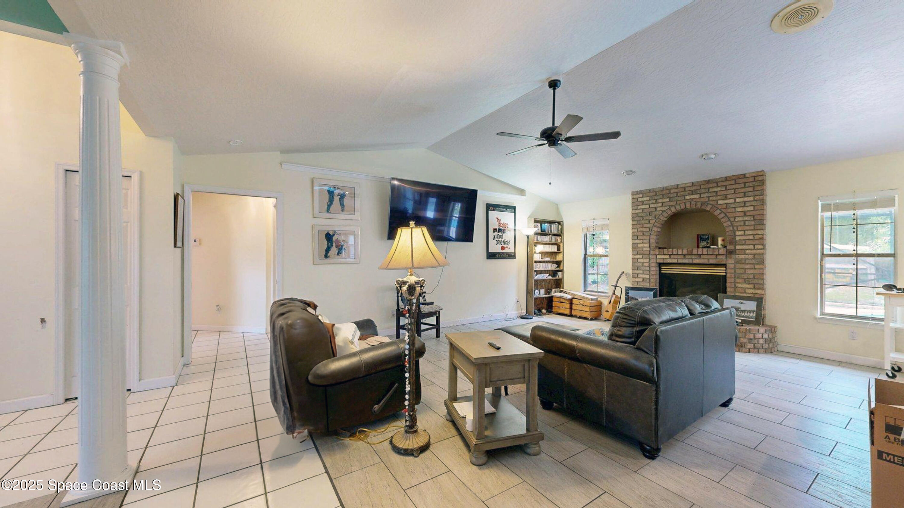 2832 School Drive Palm Bay, FL 32905 - Photo 25 of 55 a living room with furniture and wooden floor