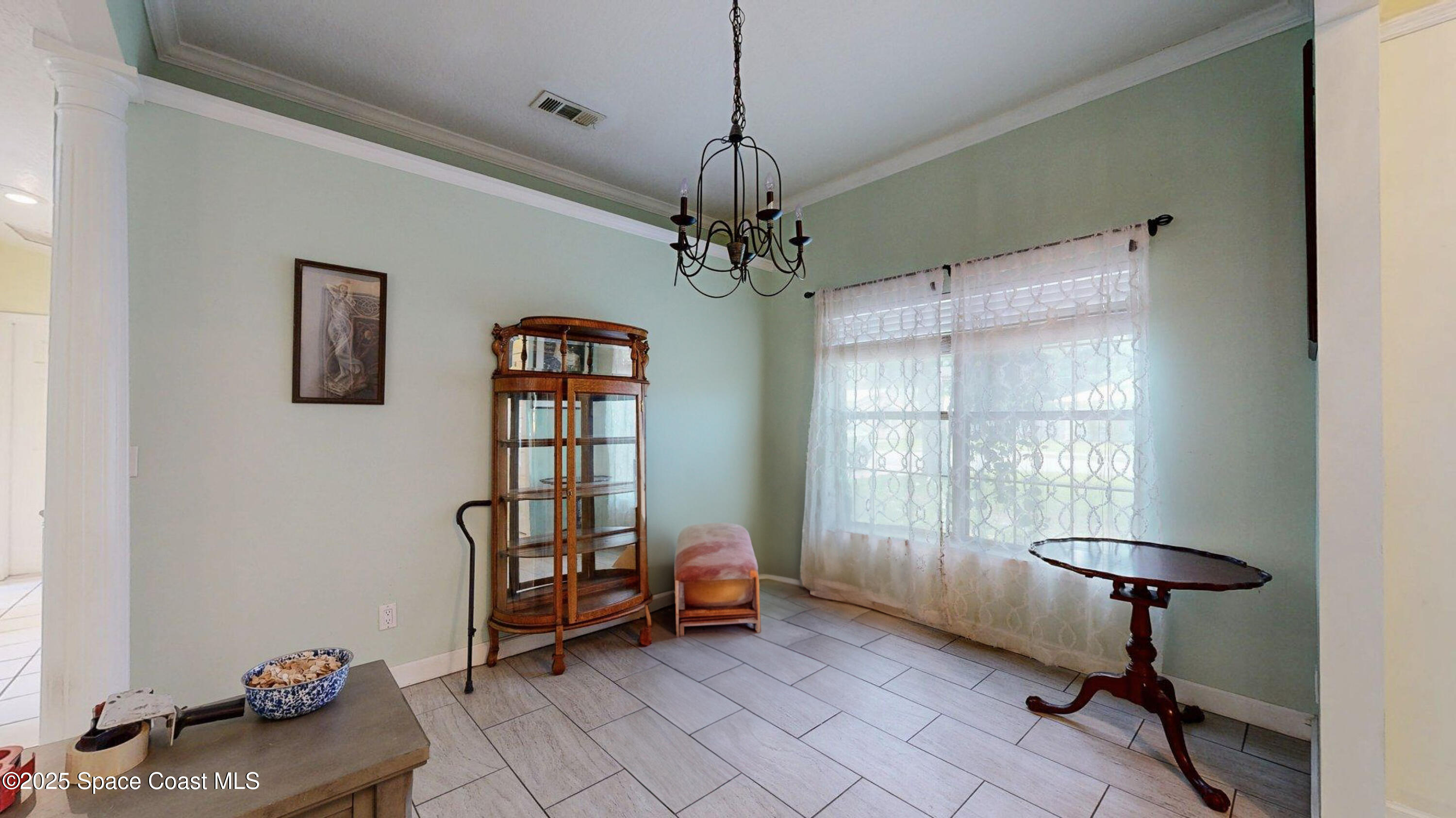 2832 School Drive Palm Bay, FL 32905 - Photo 4 of 55 a living room with furniture and a window