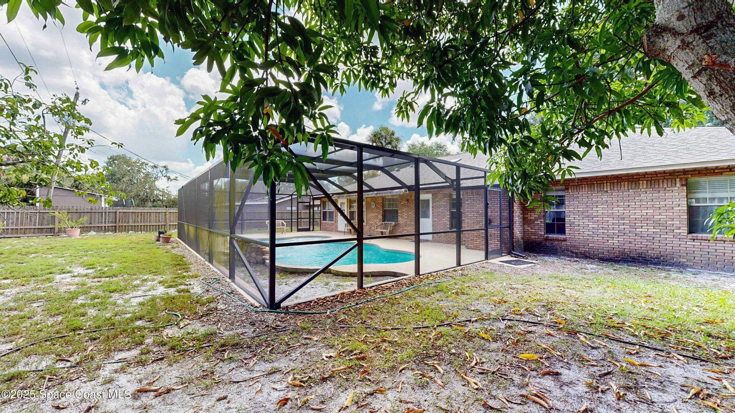 2832 School Drive Palm Bay, FL 32905 - Photo 46 of 55 a view of a backyard with a garden and entertaining space