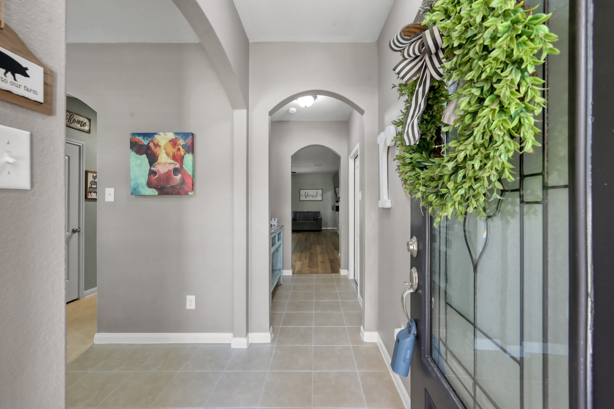 7562 Fettle Lane Conroe, TX 77304 - Photo 6 of 30 Inviting entry hallway with stylish finishes and welcoming natural flow into the home.