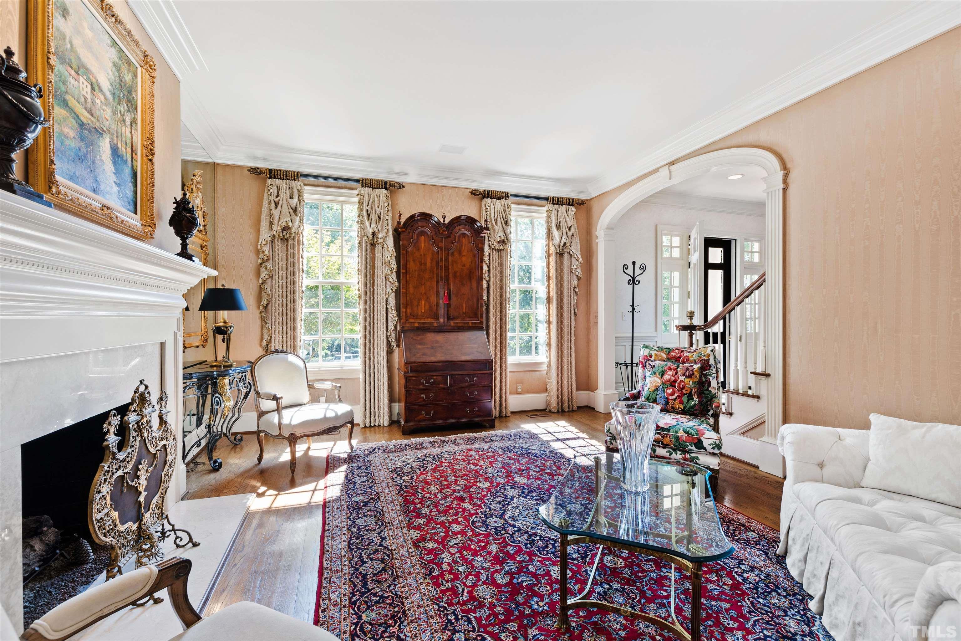 1909 Chase Court Raleigh, NC 27607 - Photo 23 of 87 a living room with furniture a fireplace and a flat screen tv