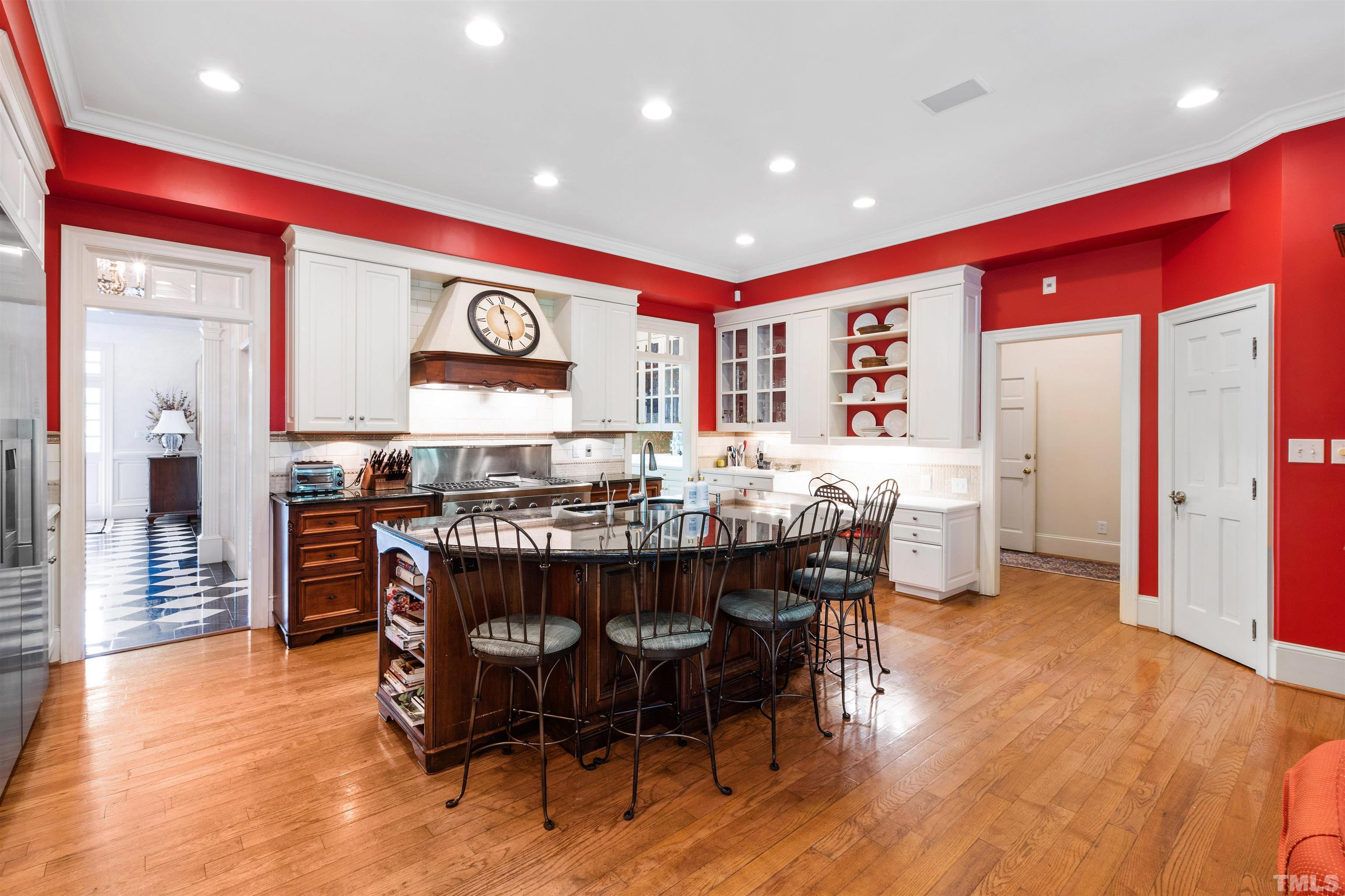 1909 Chase Court Raleigh, NC 27607 - Photo 31 of 87 a large kitchen with a table and chairs in it