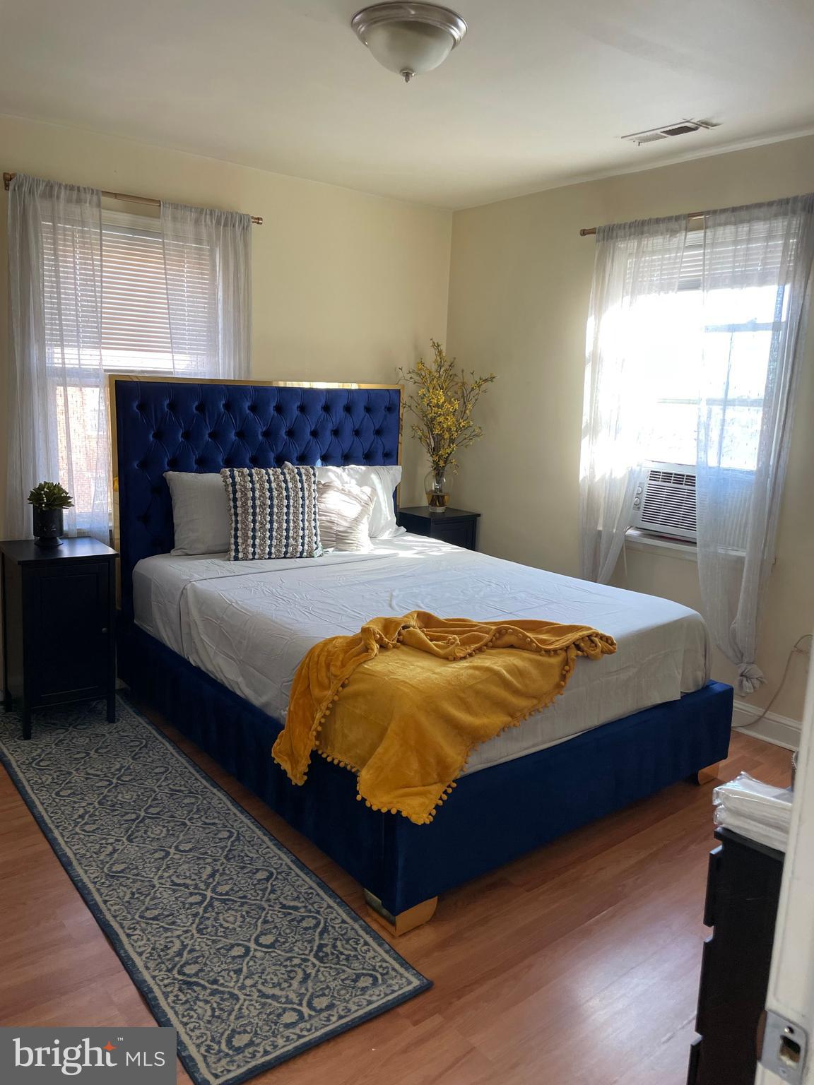 a bedroom with a large bed and a window