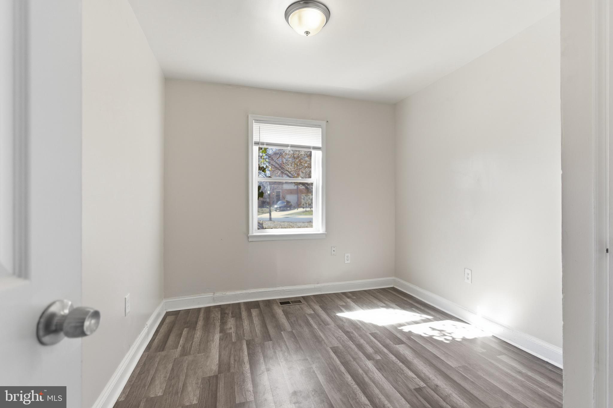 101 Wayne Place Southeast, Unit 2 Washington, DC 20032 - Photo 9 of 10 a view of empty room with wooden floor and fan
