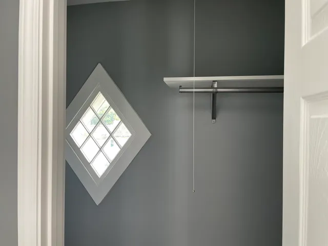 a view of a room that has a window in it