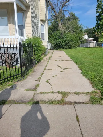 a view of a backyard of the house