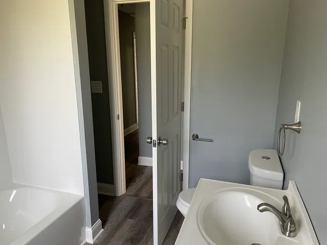 a bathroom with a toilet and a sink