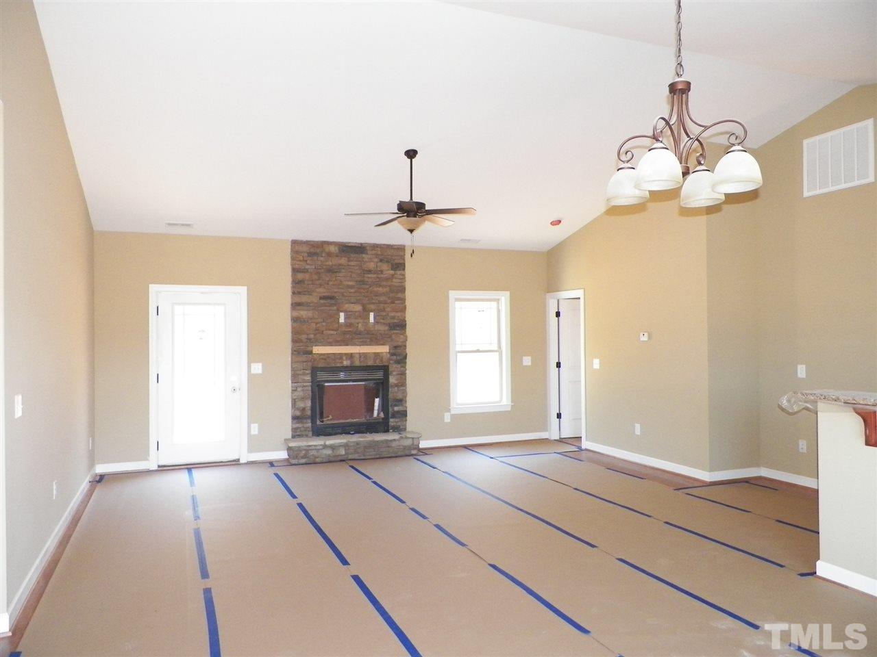 10971 Selma Road Middlesex, NC 27557 - Photo 3 of 18 a spacious bathroom with a granite countertop sink a mirror and window