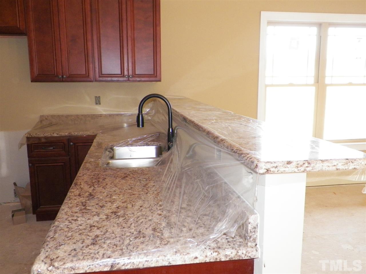 10971 Selma Road Middlesex, NC 27557 - Photo 8 of 18 a close view of a sink a faucet and appliance in the kitchen