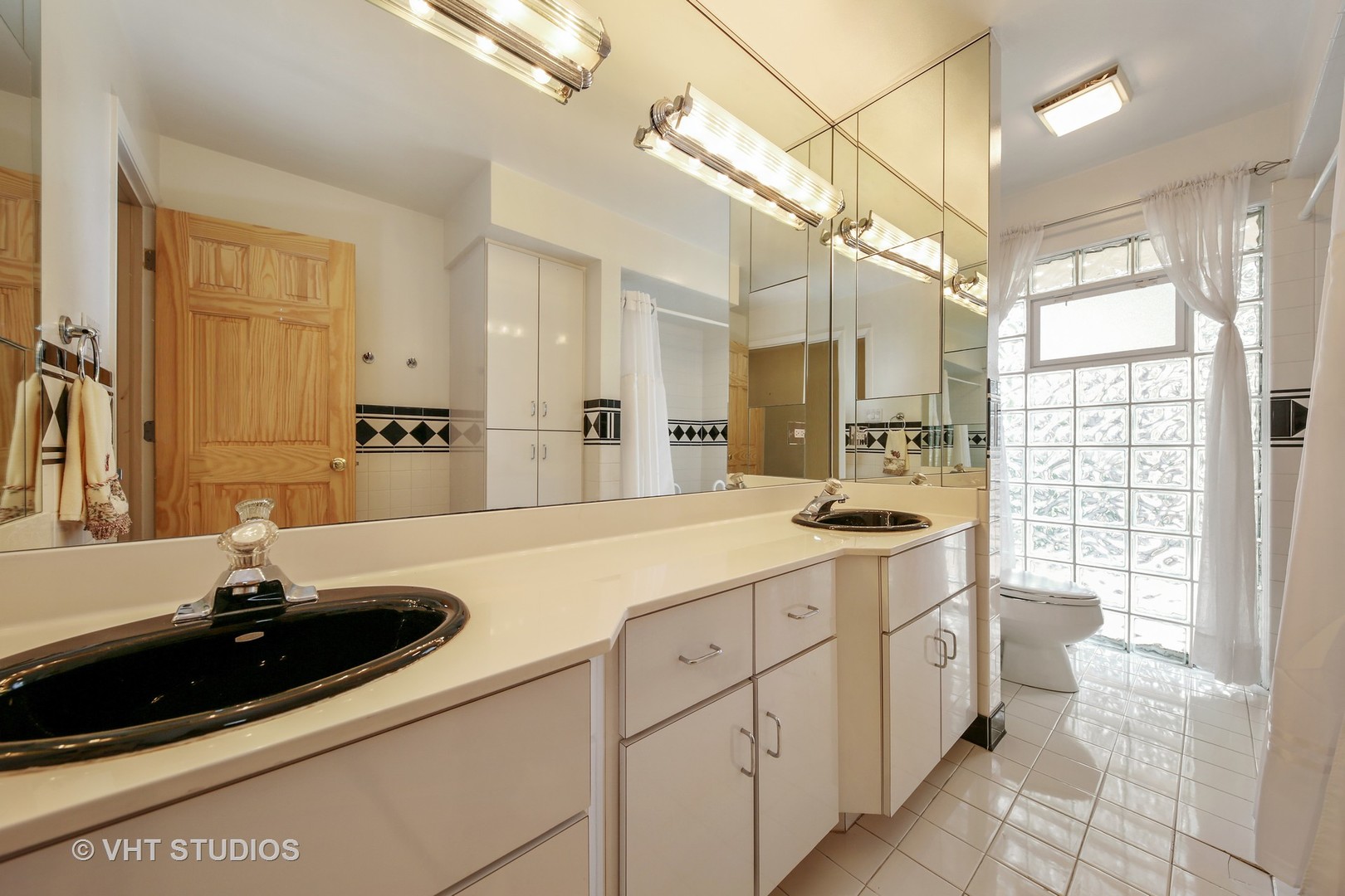 403 Uvedale Road Riverside, IL 60546 - Photo 14 of 26 a bathroom with a sink double vanity and a mirror