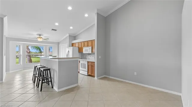 a kitchen with a refrigerator and a table