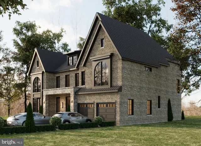 a front view of a house with a garden and plants