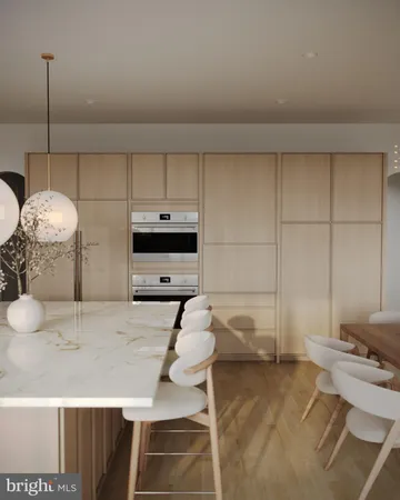 a living room with a furniture and a chandelier