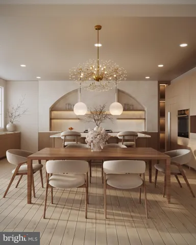 a kitchen with a table and chairs in it