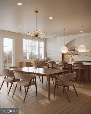 a kitchen with a table and chairs in it